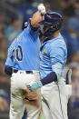 Tampa Bay Rays' Curtis Mead, right, celebrates with Ben Rortvedt after Mead hit a two-run home run off Detroit Tigers relief pitcher Will Vest during the sixth inning of a baseball game Wednesday, April 24, 2024, in St. Petersburg, Fla. (AP Photo/Chris O'Meara)
