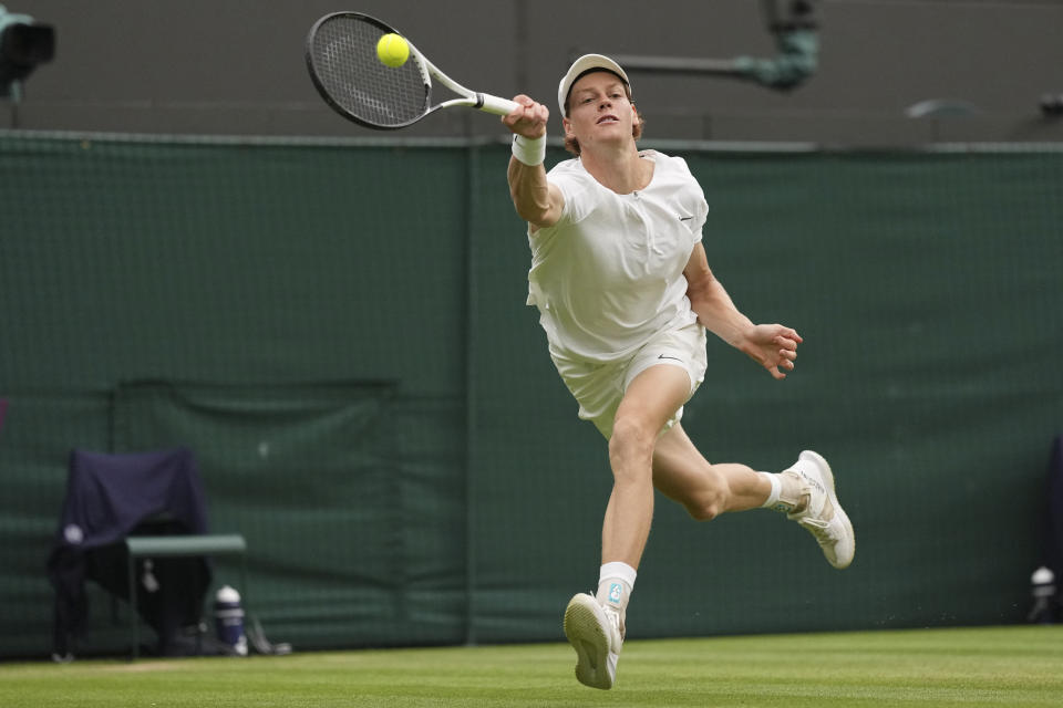 Italy's Jannik Sinner in action against Russia's Roman Safiullin during their men's singles match on day nine of the Wimbledon tennis championships in London, Tuesday, July 11, 2023. (AP Photo/Alberto Pezzali)