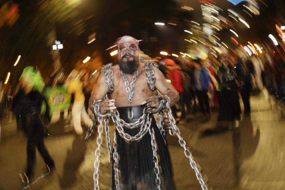 Revelers march during the Greenwich Village Halloween Parade, Thursday, Oct. 31, 2019, in New York. (AP Photo/Frank Franklin II)