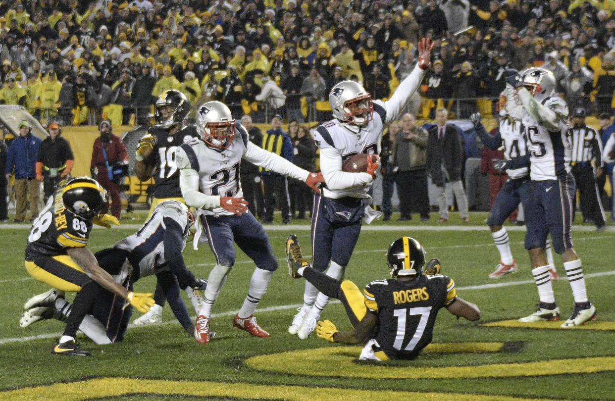 New England Patriots safety Duron Harmon, center, celebrates his game-sealing end zone interception of the Pittsburgh Steelers’ Ben Roethlisberger on Sunday. (AP)