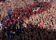 <p>A band marches among the crowd of revellers during the opening of the San Fermin festival in Pamplona, Spain, July 6, 2018. Pamplona, Spain, July 6, 2018. (Photo: Vincent West/Reuters) </p>