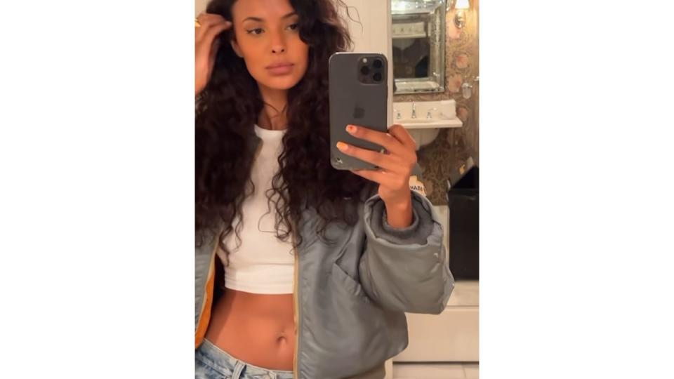 Maya taking mirror selfie in LA