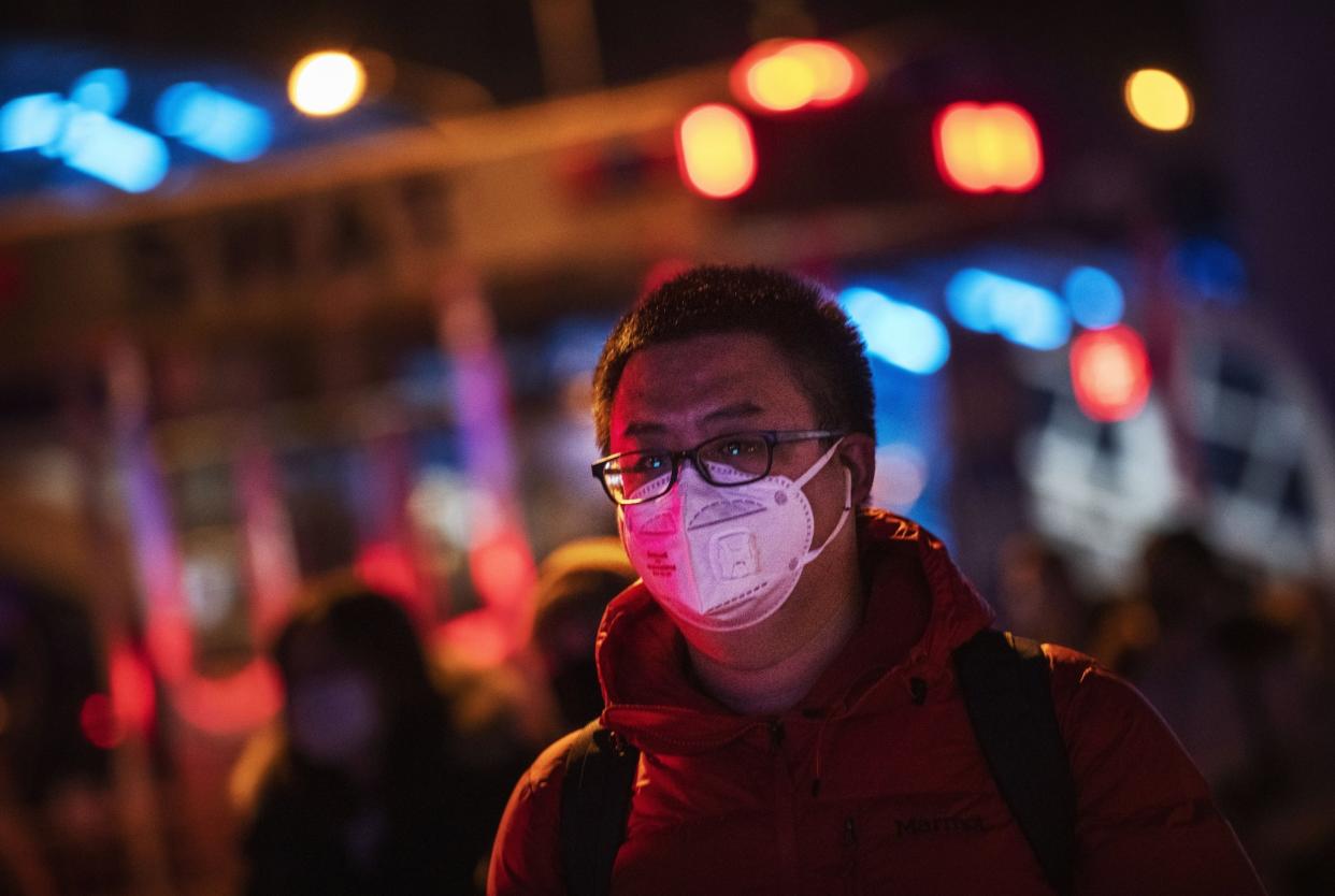 A man wears a protective mask as he arrives at Beijing railway station amid fears over the spread of the Wuhan coronavirus: Getty Images