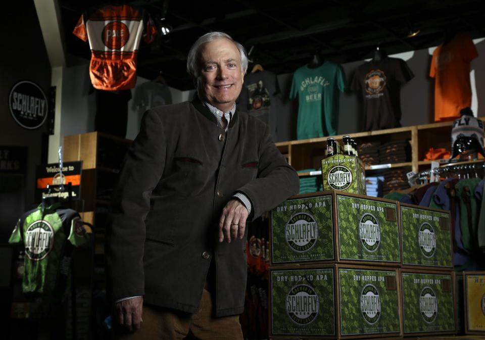 Tom Schlafly, co-founder of the brewery which produces the Schlafly brand of beers, poses for a photo inside the gift shop at Schlafly Bottleworks on Wednesday, March 12, 2014, in Maplewood, Mo. Schlafly has been in a trademark dispute with his aunt, conservative activist Phyllis Schlafly, over whether Schlafly is primarily a last name or a commercial brand that deserves legal protection. (AP Photo/Jeff Roberson)