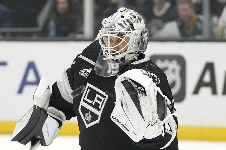 Los Angeles Kings goaltender Cam Talbot makes a glove save during the first period of an NHL hockey game against the Colorado Avalanche Wednesday, Oct. 11, 2023, in Los Angeles. (AP Photo/Mark J. Terrill)