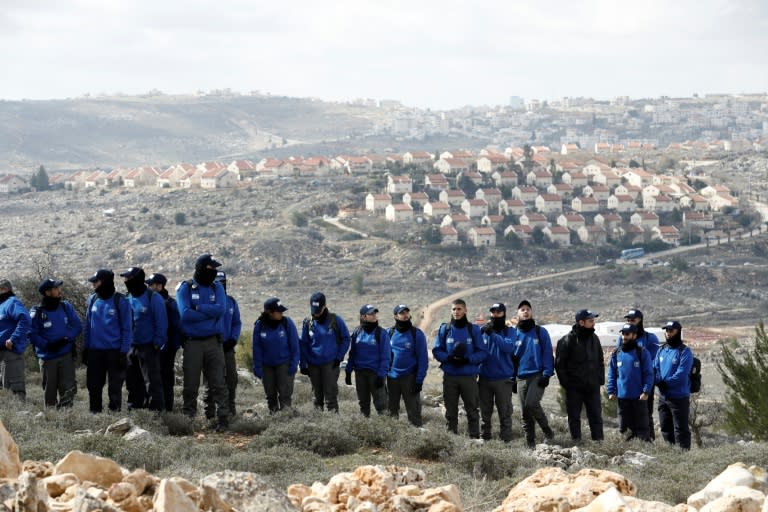 Israeli security forces gather at the Amona outpost, northeast of Ramallah, as they prepare to evict hardline Jewish occupants of the wildcat settlement outpost on February 1, 2017