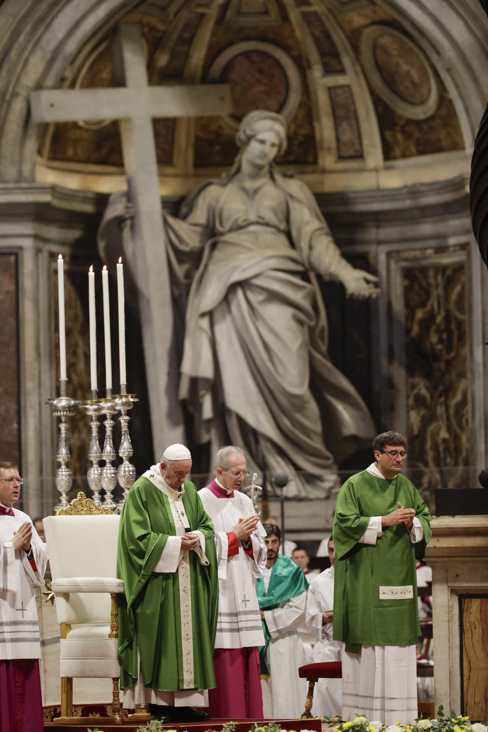 Pope Francis celebrates a Mass in St. Peter Basilica at the Vatican, Sunday, Nov. 17, 2019. Pope Francis is offering several hundred poor people, homeless, migrants, unemployed a lunch on Sunday as he celebrates the World Day of the Poor with a concrete gesture of charity in the spirit of his namesake, St. Francis of Assisi. (AP Photo/Alessandra Tarantino)