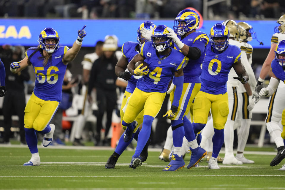 Los Angeles Rams safety Jordan Fuller (4) celebrates after intercepting a pass against the New Orleans Saints during the second half of an NFL football game Thursday, Dec. 21, 2023, in Inglewood, Calif. (AP Photo/Ashley Landis)