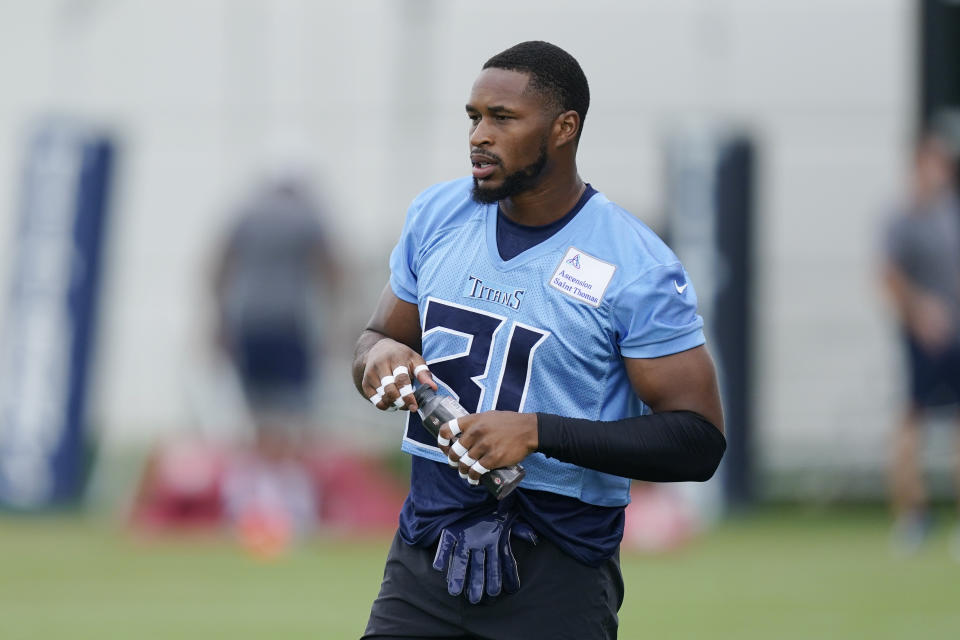 Tennessee Titans safety Kevin Byard stretches during training camp at the NFL football team's practice facility, Thursday, July 28, 2022, in Nashville, Tenn. Training camp is giving two-time All-Pro Byard a sense of normalcy as the Tennessee Titans safety works through the grief over his mother's unexpected death earlier this summer. (AP Photo/Mark Humphrey)