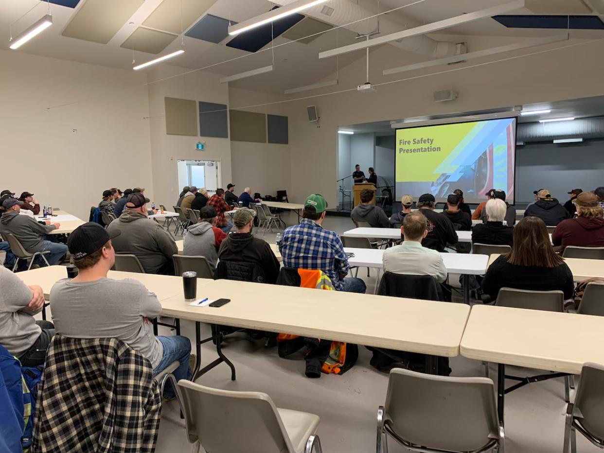 Dozens of potential volunteers attend an information session in Breton, Alta., on Wednesday as the province prepares for this year's wildfire season.  (Julia Wong/CBC - image credit)