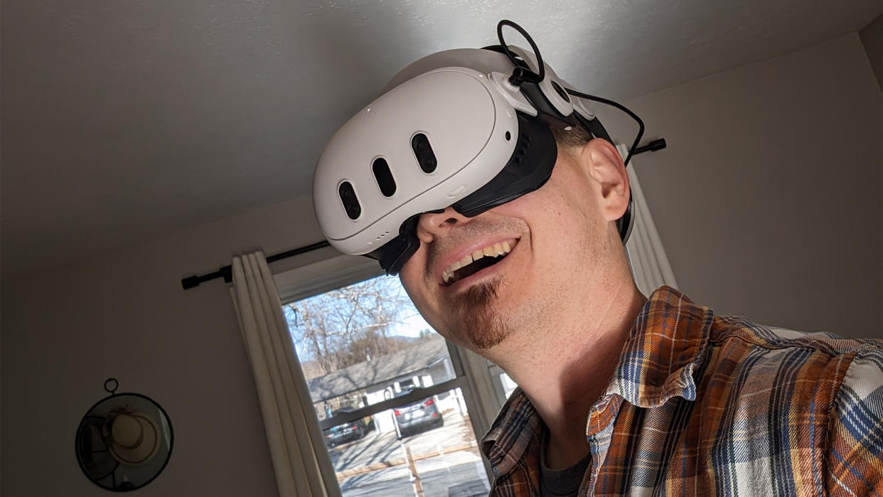  Smiling while wearing a Meta Quest 3 headset with a BoboVR M3 Pro head strap. 