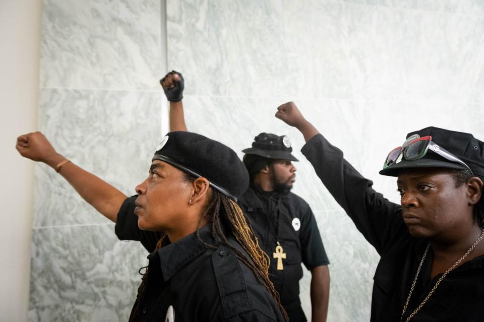 Members of the Black Panther Party  stand in line during a hearing on reparations for slavery in Washington. 