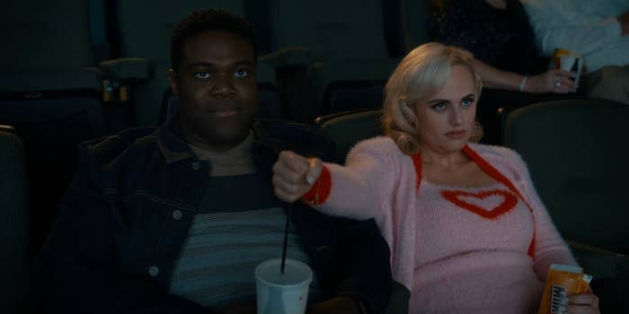 Rebel Wilson and Sam Richardson watch a movie