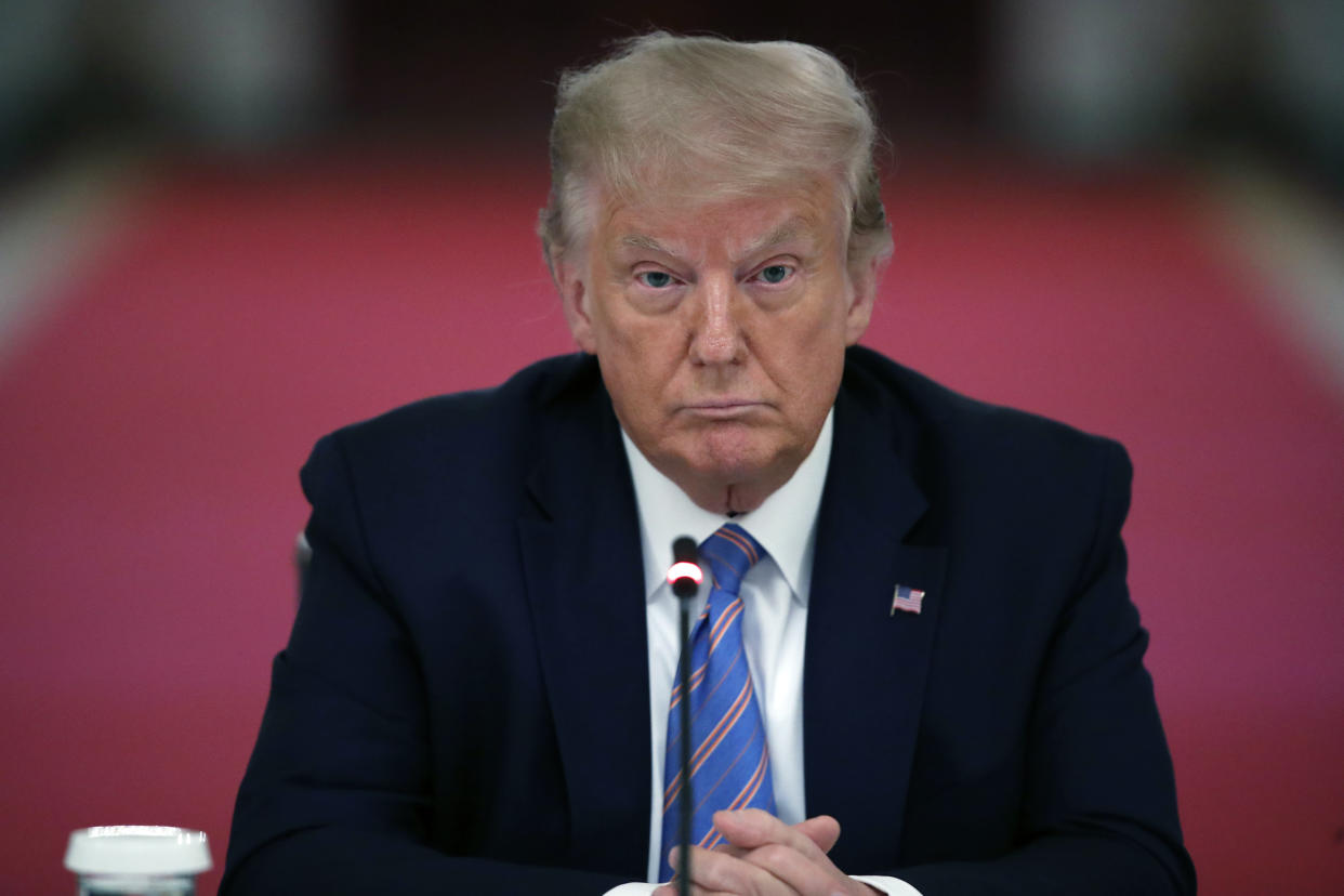 FILE - President Donald Trump listens during a "National Dialogue on Safely Reopening America's Schools," event in the East Room of the White House, on July 7, 2020, in Washington. A federal judge has rejected former President Donald Trump’s request to block the release of documents to the House committee investigating the Jan. 6 Capitol riot. U.S. District Judge Tanya Chutkan on Tuesday, Nov. 9 declined to issue a preliminary injunction sought by Trump’s lawyers. (AP Photo/Alex Brandon, File)