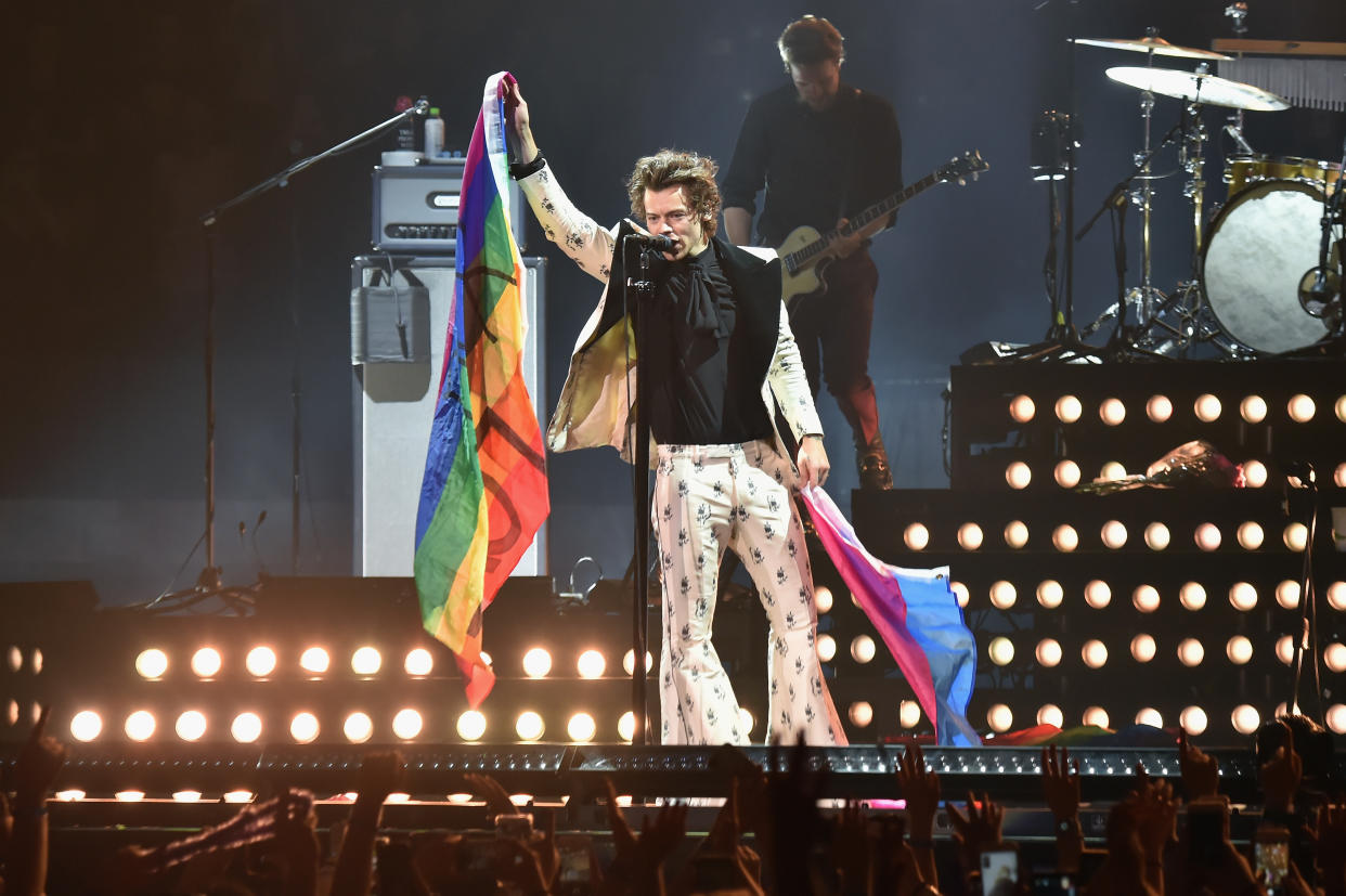 Harry Styles holds rainbow flags as he performs onstage during Harry Styles: Live On Tour - New York at Madison Square Garden on June 21, 2018 in New York City.  (Photo by Kevin Mazur/Getty Images for HS)