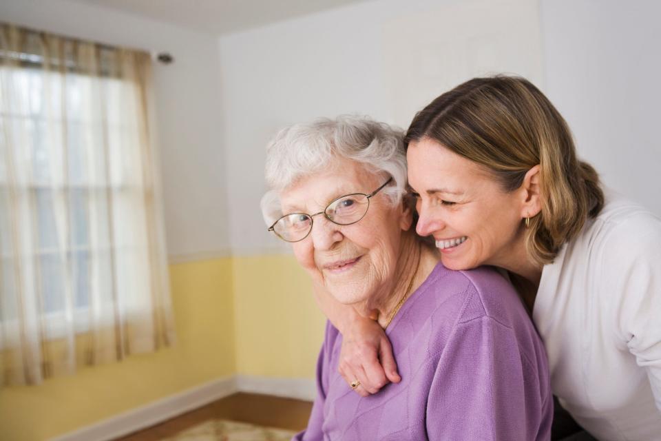 woman hugging elderly mother