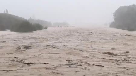 Motueka River swollen after Gita storm hit New Zealand is seen in Tasman, New Zealand, in this still image taken from a video from February 20, 2018. Mandatory credit. Sara Jowsey via REUTERS