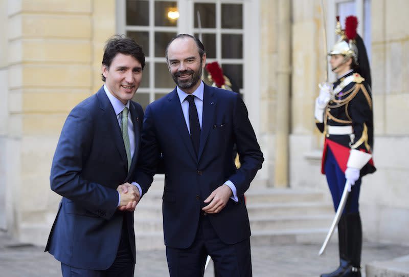 PHOTOS: Justin Trudeau meets with leaders in Lima, Paris and London