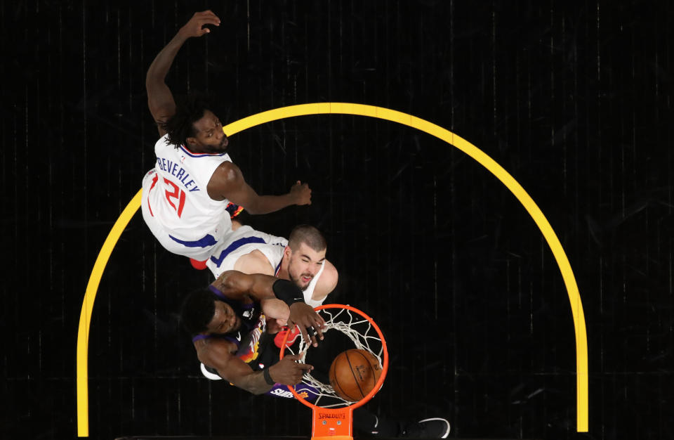 Suns star DeAndre Ayton throws down the game-winning dunk over the Clippers' defense with 0.7 seconds left in Game 2 of the Western Conference finals. (Christian Petersen/Getty Images)
