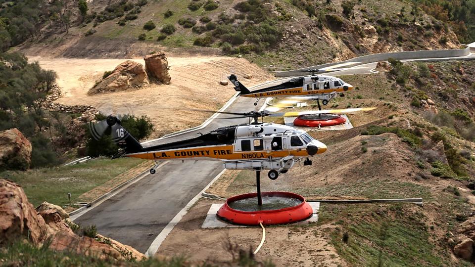 L.A. County Firehawk helicopters fill their water tanks at a fire base in Topanga Canyon.