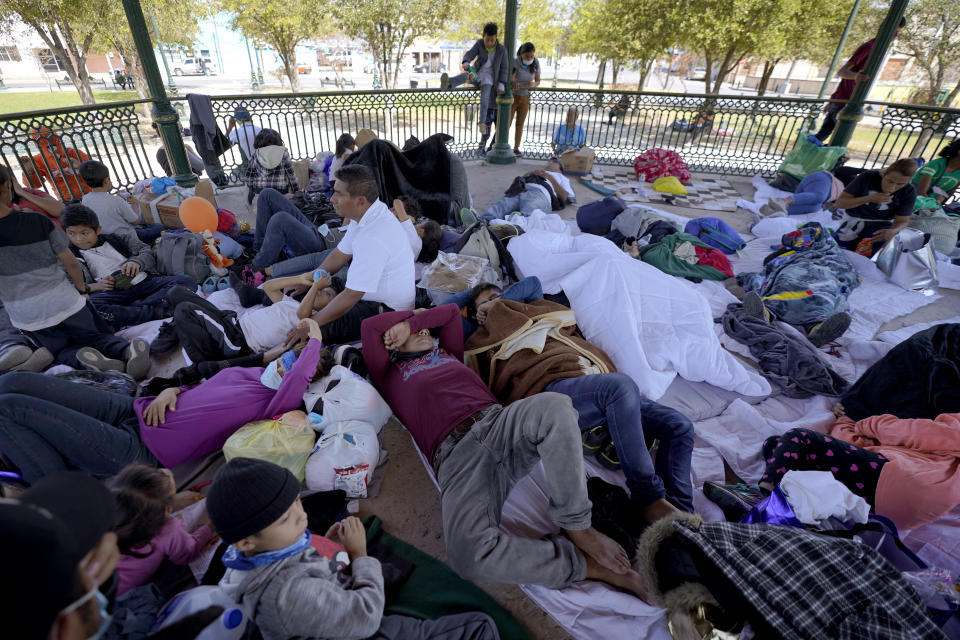 A group of migrants rest on a gazebo at a park after they were expelled from the U.S. and pushed by Mexican authorities off an area where they had been staying, Saturday, March 20, 2021, in Reynosa, Mexico. The fate of thousands of migrant families who have recently arrived at the Mexico border is being decided by a mysterious new system under President Joe Biden. U.S. authorities are releasing migrants with “acute vulnerabilities” and allowing them to pursue asylum. But it's not clear why some are considered vulnerable and not others. (AP Photo/Julio Cortez)