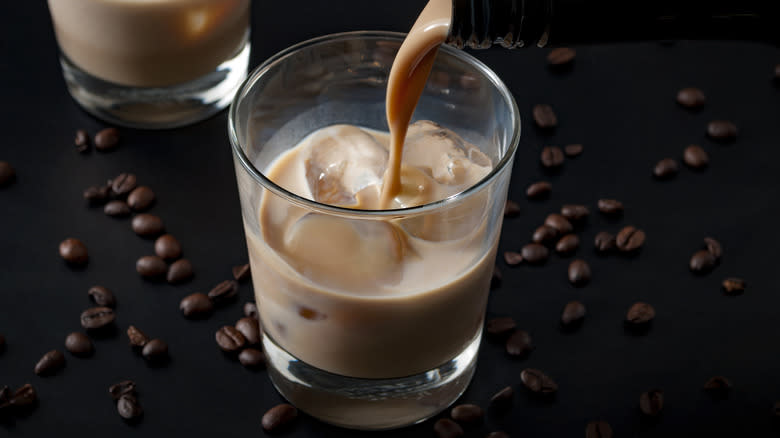 Pouring Irish cream into coffee