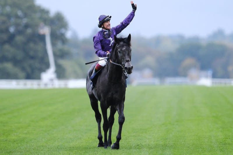 Frankie Dettori celebrates after winning the Group 1 British Champions Cup on King of Steel. Megan Rose Photography, courtesy of Ascot Racecourse