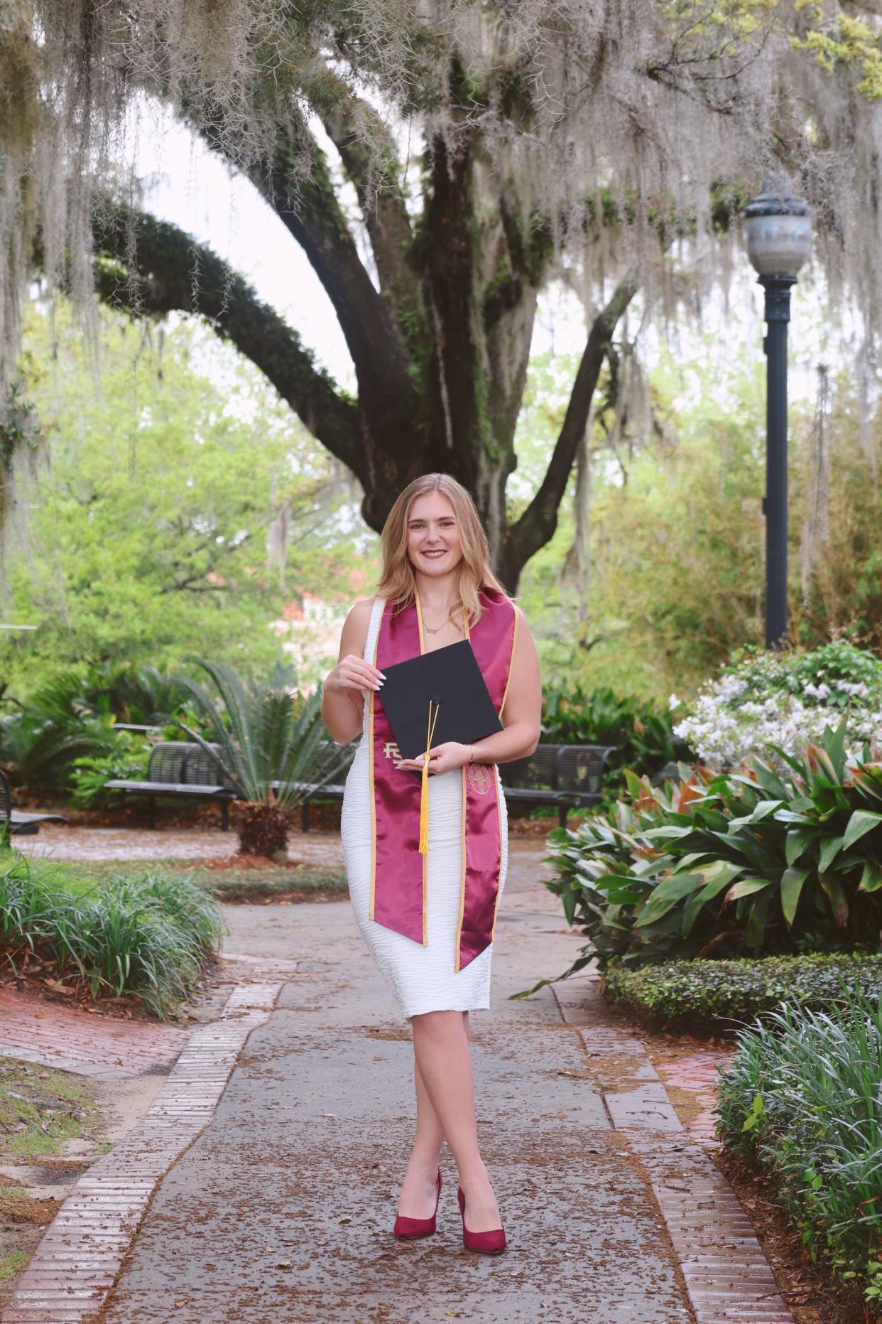 Taylor Brown pictured on Florida State's campus for her graduation shoot.