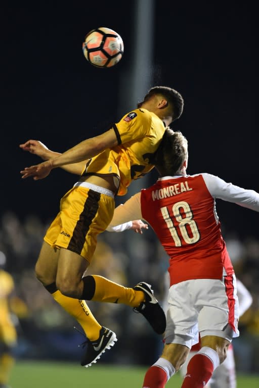 Sutton United's striker Maxime Biamou (L) vies with Arsenal's defender Nacho Monreal during the English FA Cup fifth round football match between Sutton United and Arsenal on February 20, 2017