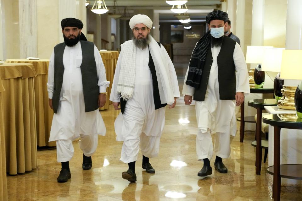 FILE In this file photo taken on Friday, July 9, 2021, Members of political delegation from the Afghan Taliban's movement Suhil Shaheen, left, Mawlawi Shahabuddin Dilawar, center, and Dr, Mohammad Naim, arrive to attend a news conference in Moscow, Russia. Moscow expects the Taliban to fulfill its pledge not to threaten Russia or its allies in Central Asia, Zamir Kabulov, the Kremlin envoy on Afghanistan said in an interview published Wednesday July 14, 2021. Zamir Kabulov, who met with the Taliban delegation that visited Moscow last week, voiced confidence that the Taliban would focus on securing their gains in Afghanistan and wouldn't try to challenge the countries of the region. (AP Photo/Alexander Zemlianichenko, File)