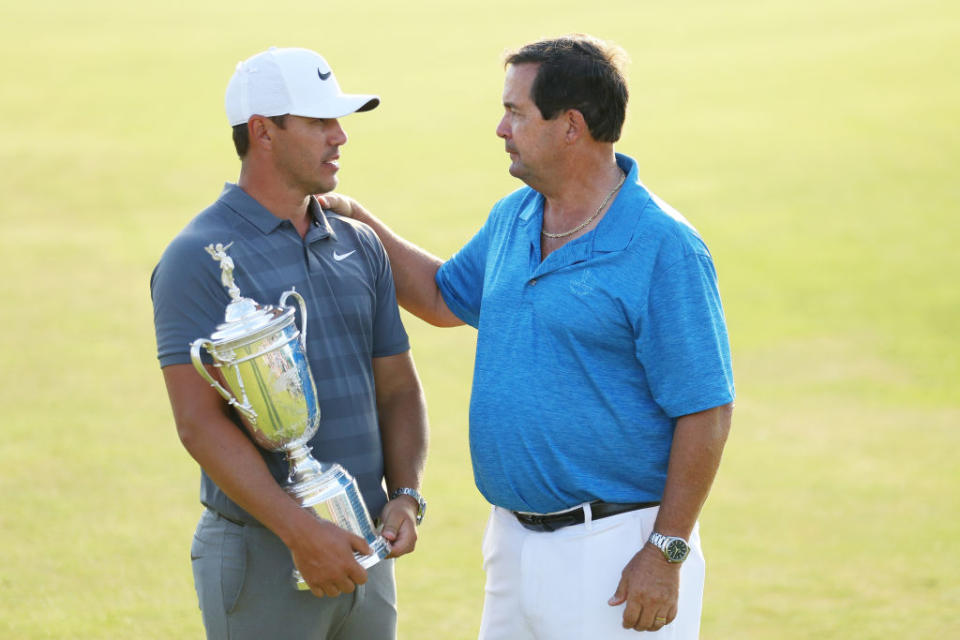 Bob Koepka, right, congratulates his son Brooks after winning back-to-back U.S. Opens. (Getty)