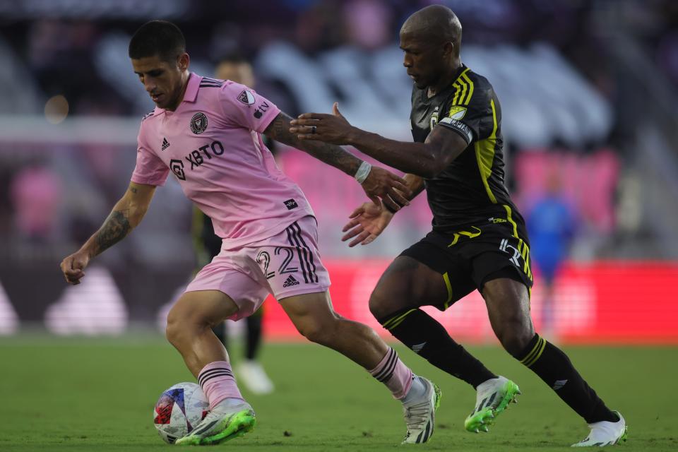 Jul 4, 2023; Fort Lauderdale, Florida, USA; Inter Miami forward Nicolas Stefanelli (22) and Columbus Crew SC midfielder Darlington Nagbe (6) battle for the ball during the first half at DRV PNK Stadium. Mandatory Credit: Sam Navarro-USA TODAY Sports