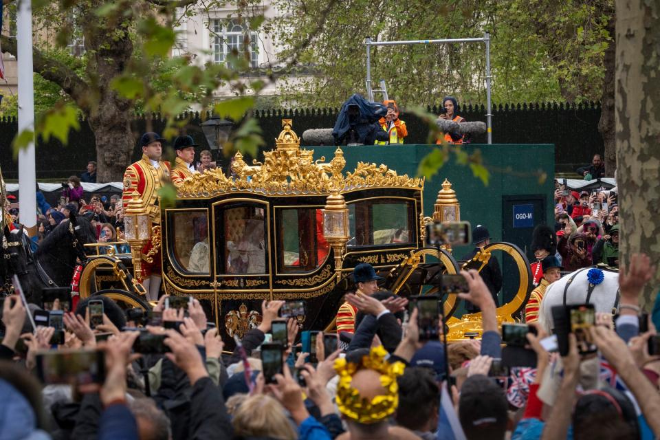 London, England; King Charles III and Queen Camilla process along The Mall in the Diamond Jubilee State Coach on the morning of their coronation in London. The May 6 event marks the first time in 70 years that Britain has crowned a new monarch. The last coronation took place for the late Queen Elizabeth II on June 2, 1953.