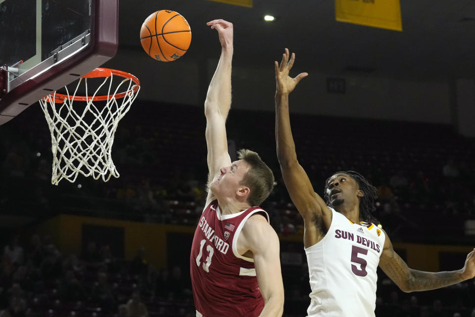 Stanford guard Michael Jones (13) misses a dunk as he gets past Arizona State guard Jamiya Neal (5) during the first half of an NCAA college basketball game Thursday, Feb. 1, 2024, in Tempe, Ariz. (AP Photo/Ross D. Franklin)