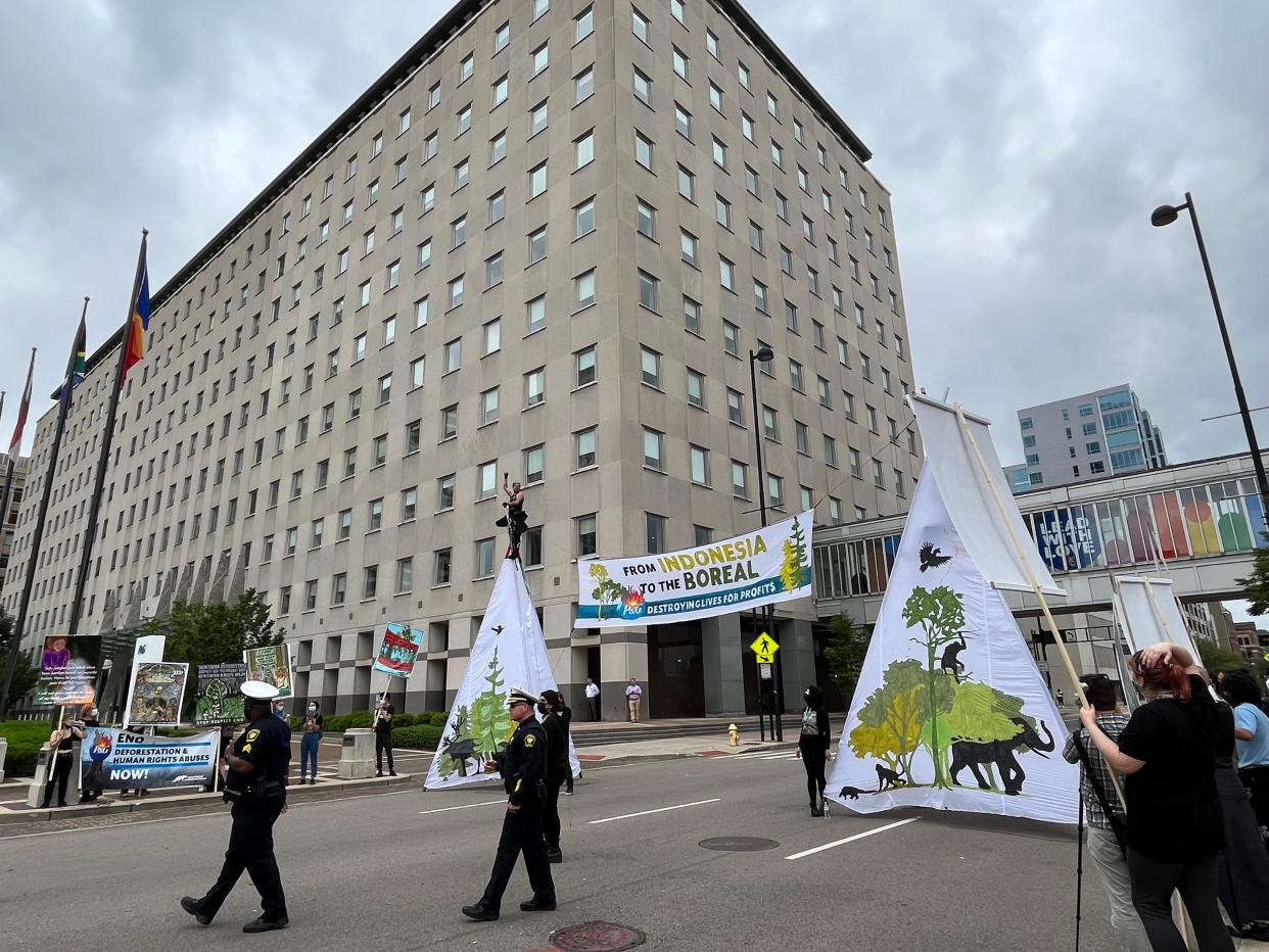 Environmental protesters gathered outside P&G's downtown headquarters forcing Cincinnati police to close part of Broadway Street on Tuesday, June 7, 2022.