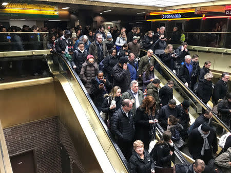 Commuters exit the New York Port Authority in New York City, U.S. December 11, 2017 after reports of an explosion. REUTERS/Edward Tobin