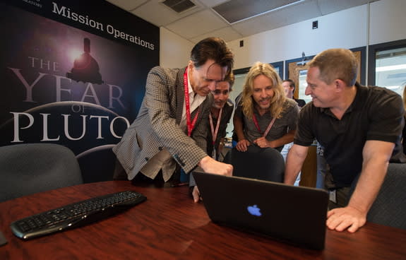 Styx and Stern: Styx band members are intrigued by the latest images of Pluto and Charon from New Horizons. Left to right: Lawrence Gowan, Todd Sucherman, Tommy Shaw, New Horizons principal investigator Alan Stern.