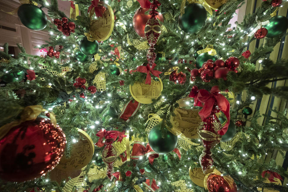 A tree in the State Dining Room is decorated during the 2019 Christmas preview at the White House, Monday, Dec. 2, 2019, in Washington. (AP Photo/Alex Brandon)