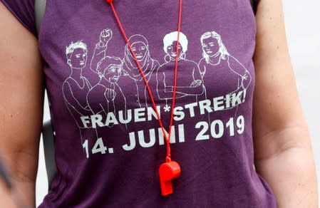 A woman wears a t-shirt with the date of the women's strike in Zurich