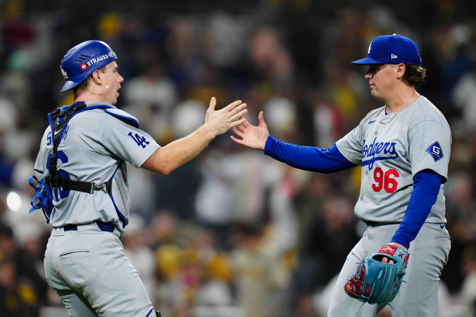 SAN DIEGO, CA – OCTOBER 9: Will Smith #16 and Landon Knack #96 of the Los Angeles Dodgers celebrate after winning Game 4 of the Division Series presented by Booking.com between the Los Angeles Dodgers and the San Diego Padres at Petco Park Wednesday, October 9, 2024 in San Diego, California. (Photo by Daniel Shirey/MLB Photos via Getty Images)