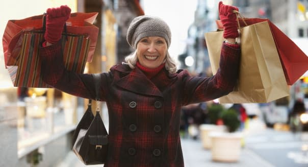 Senior woman holding shopping bags