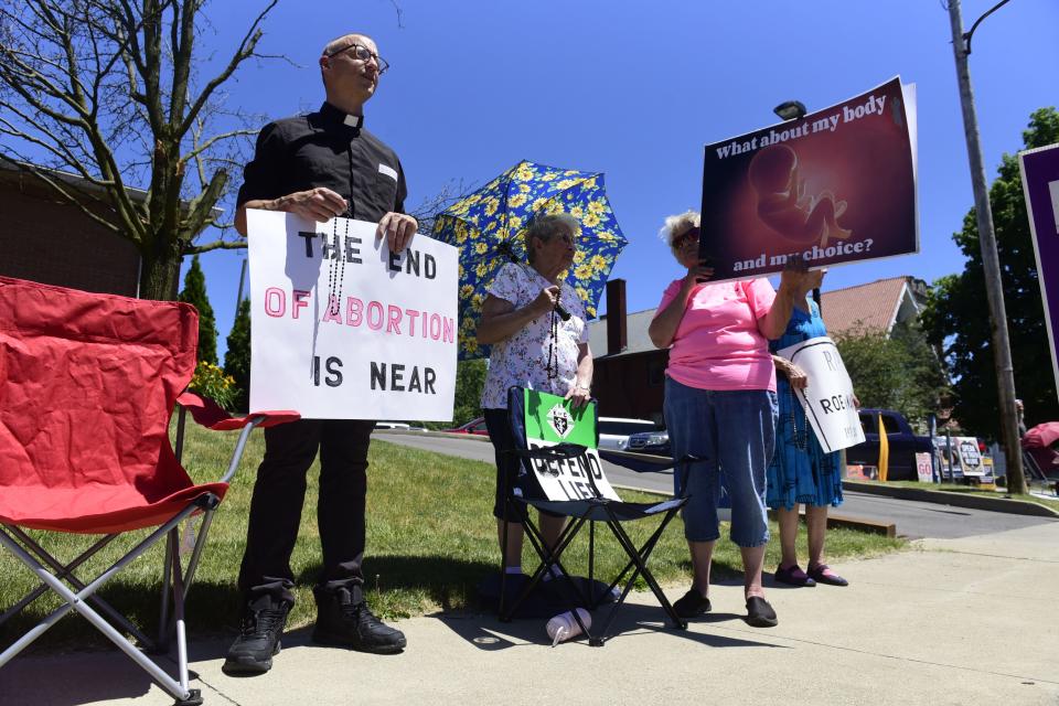 Nearly two dozen people gathered through the day to commemorate Friday's overturning of Roe v. Wade outside the Planned Parenthood office in Mansfield.