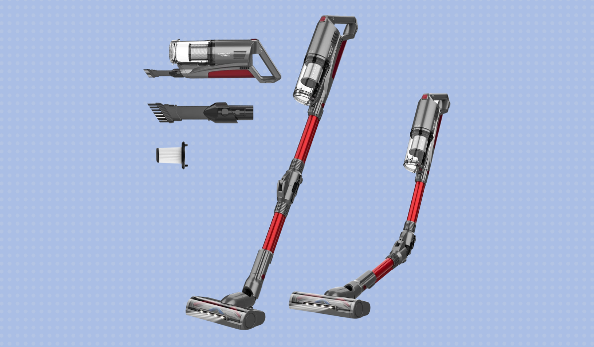 A red and grey stick vacuum along with additional attachments