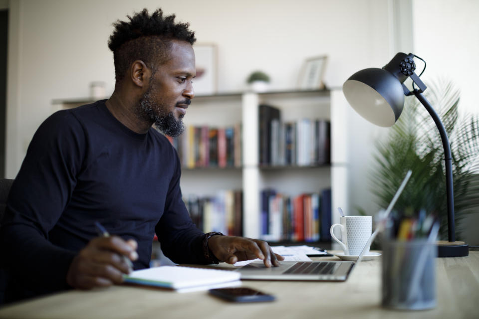 Smiling man working at home