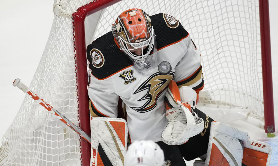 Anaheim Ducks goaltender Lukas Dostal stops a shot in the first period of an NHL hockey game against the Colorado Avalanche on Wednesday, Nov. 15, 2023, in Denver. (AP Photo/David Zalubowski)