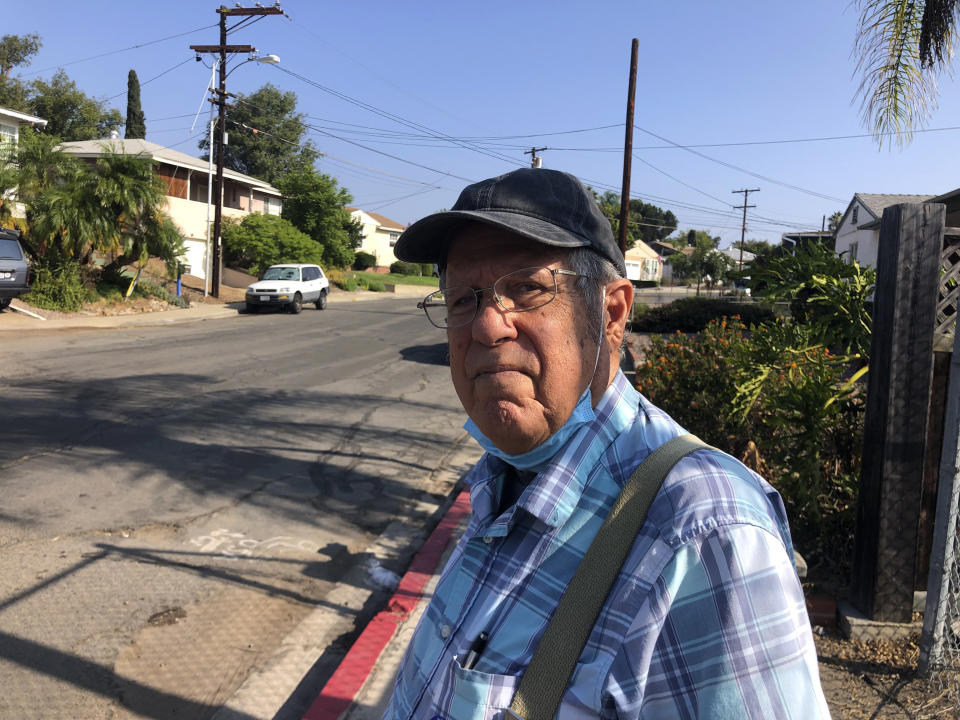 Joe Cusumano, 77, poses for a photo on Tuesday, Sept. 14, 2021, outside a San Diego polling site after casting his ballot in favor of recalling California Gov. Gavin Newsom. Cusumano, a barber, said he wants Newsom to be replaced by conservative radio host Larry Elder who he said is more knowledgeable. (AP Photo by Julie Watson)