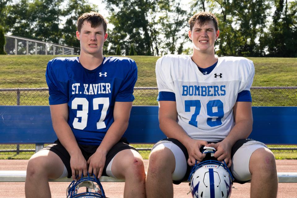 Justin Kattus, left, a St. Xavier junior and linebacker, and his brother, Tucker, a St. Xavier sophomore and offensive lineman, are the sons of Eric Kattus, a former NFL player who played for the Bengals for the first six years of his career from 1986 to 1991.