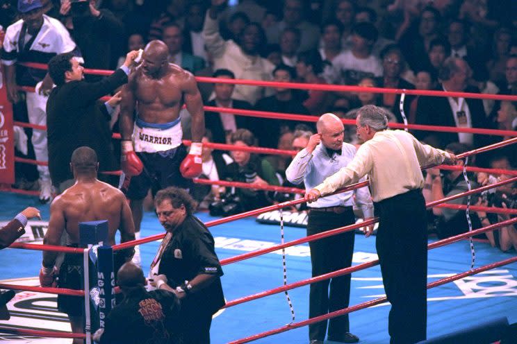 Evander Holyfield has his right ear checked by after he was bit in the ear by Mike Tyson in the third round of their WBA Heavyweight match Saturday, June 28, 1997, at the MGM Grand in Las Vegas.