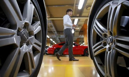 Logos of Volkswagen (R) and Audi are seen on a wheel of a car at a used car dealership in Seoul, South Korea, October 2, 2015. REUTERS/Kim Hong-Ji