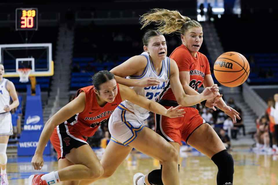 From left to right,Princeton guard Skye Belker, UCLA forward Gabriela Jaquez, and forward Ellie Mitchell vie for the ball during the second half of an NCAA college basketball game, Friday, Nov. 17, 2023, in Los Angeles. (AP Photo/Ryan Sun)